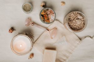 pink jade roller near menstrual cup