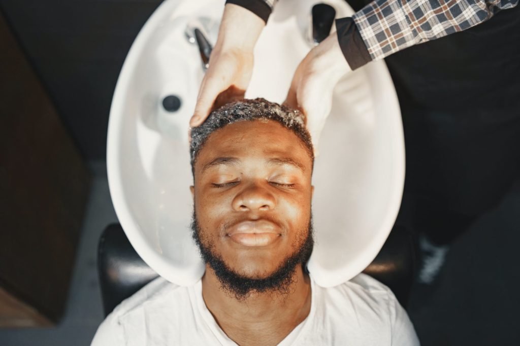 man having his hair washed in a hair salon