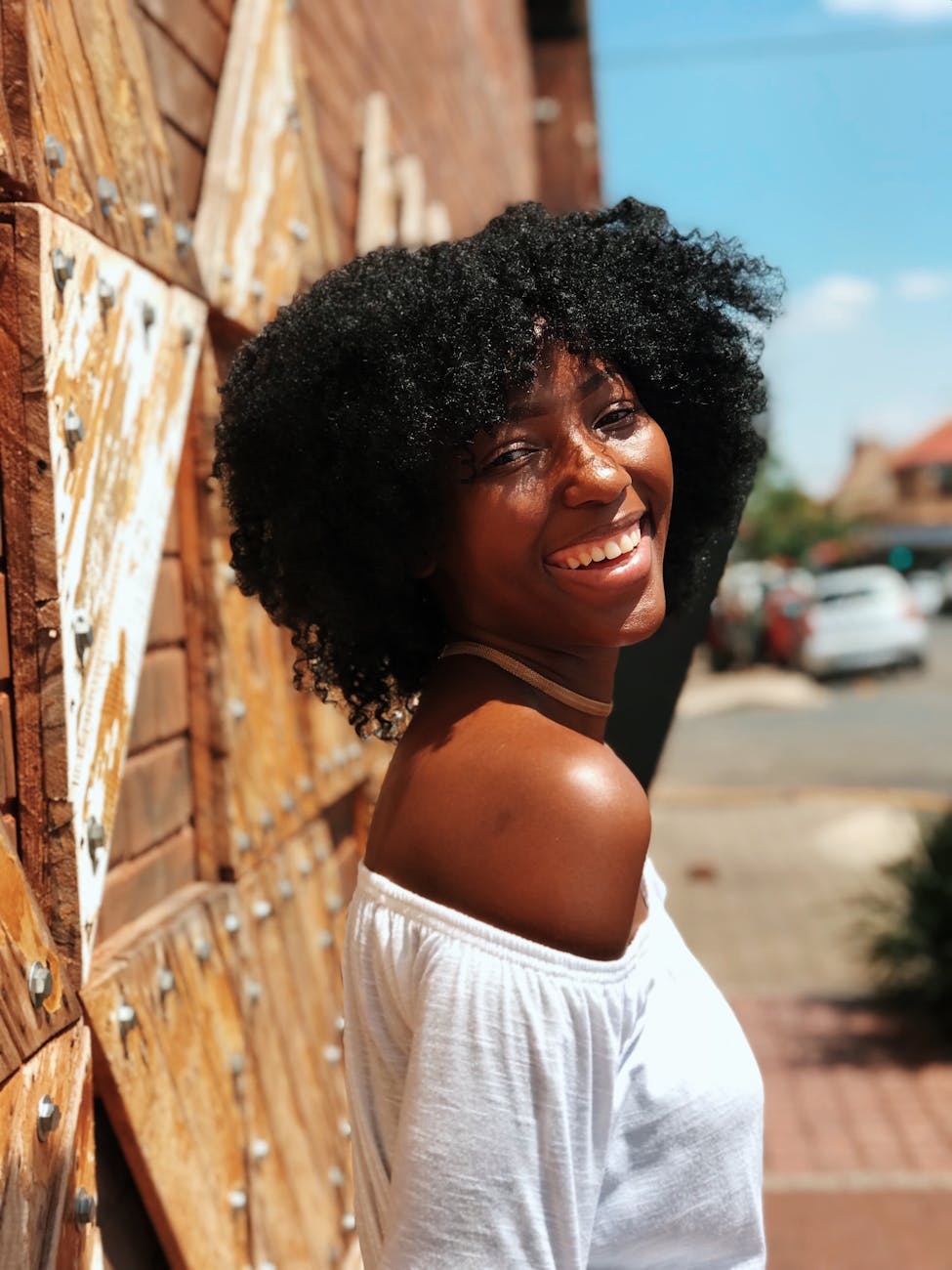 woman in white shirt smiling